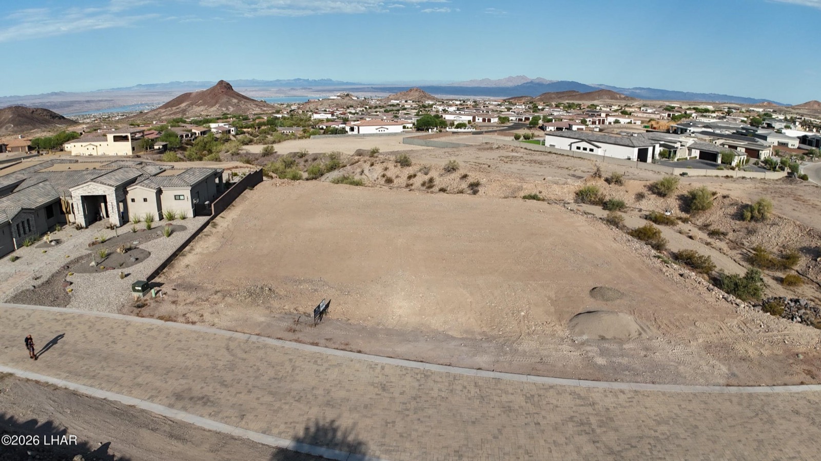 Aerial view of the 2991 Plaza Enclave lot with Lake Havasu and the mountains beyond
