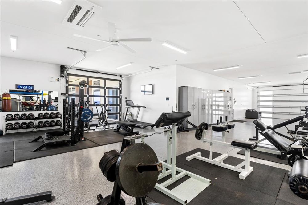 Home gym area at the rear of the 74-foot-deep two-car garage