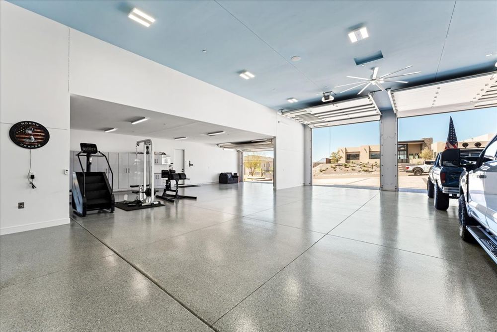 Garage interior with the door open to the driveway