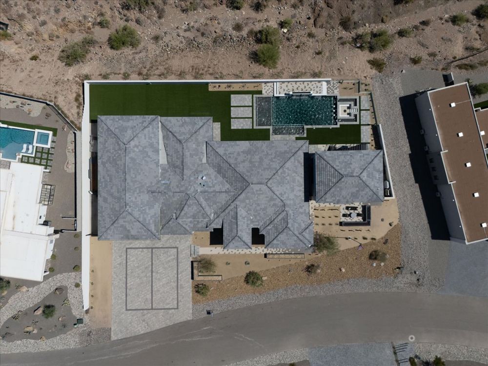 Aerial view of the home and backyard