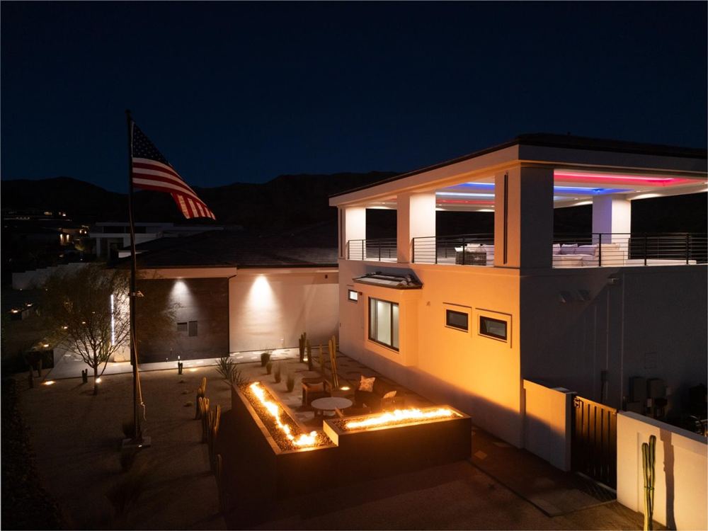 Exterior at night with courtyard fire features