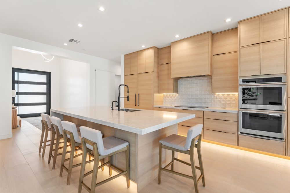 Kitchen with a long island and counter seating