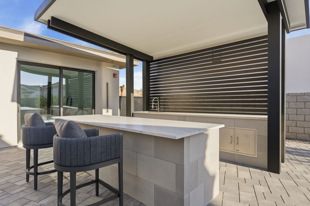 Outdoor kitchen with bar seating