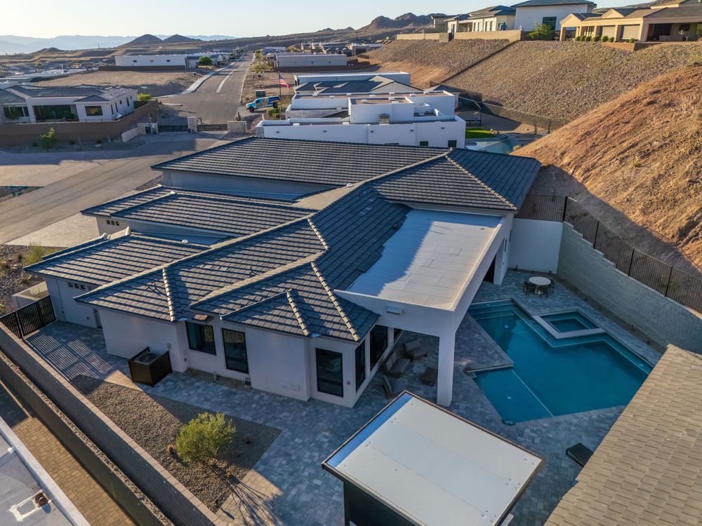 Aerial view of the home, pool and backyard