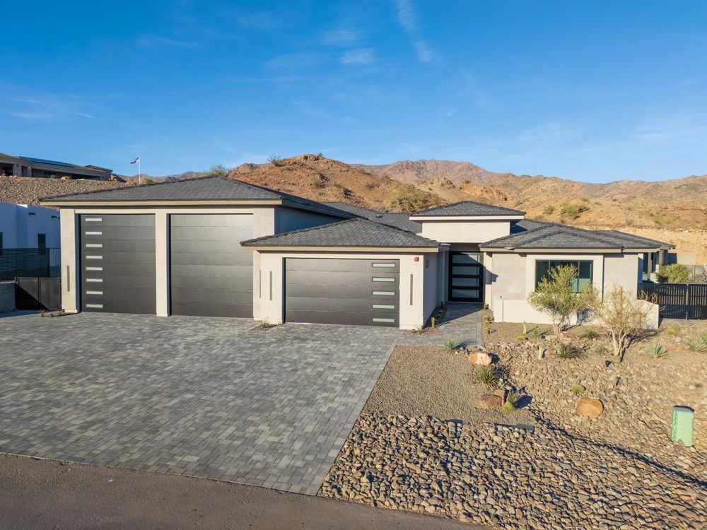 Street view of the home and its three garage doors