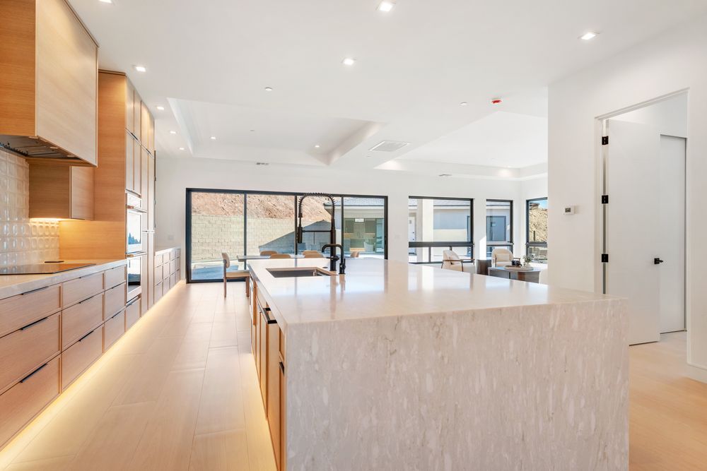 Kitchen island facing the sliding doors to the backyard