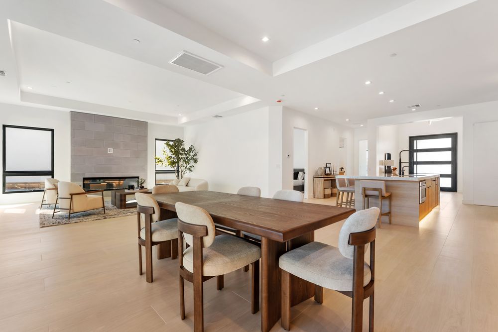 Dining area with the fireplace and kitchen beyond