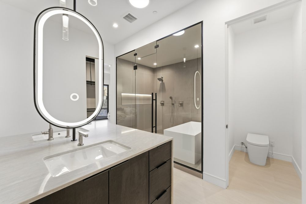 Primary bath vanity, shower and private toilet room