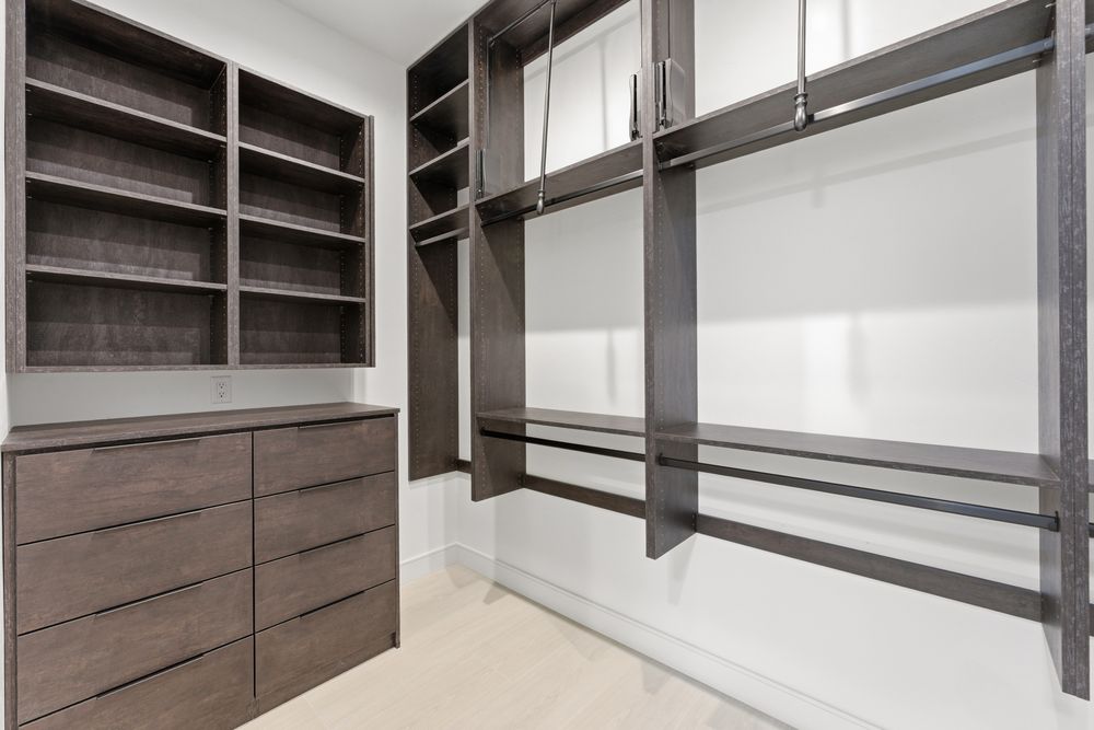 Primary walk-in closet with built-in drawers