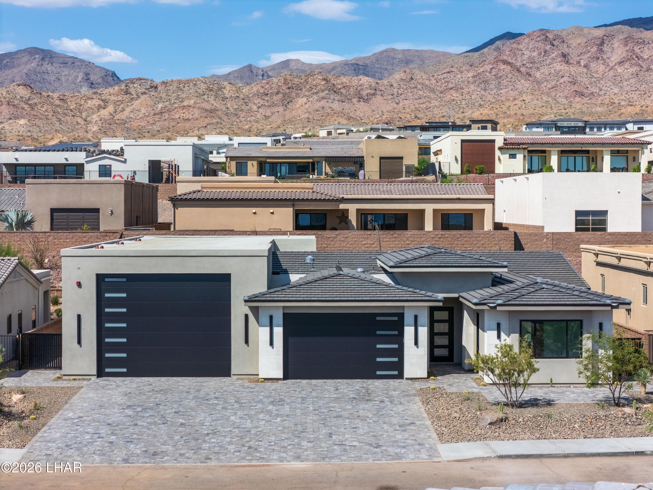 Exterior view of 6873 Avienda De Los Foothills against the Havasu Foothills mountains
