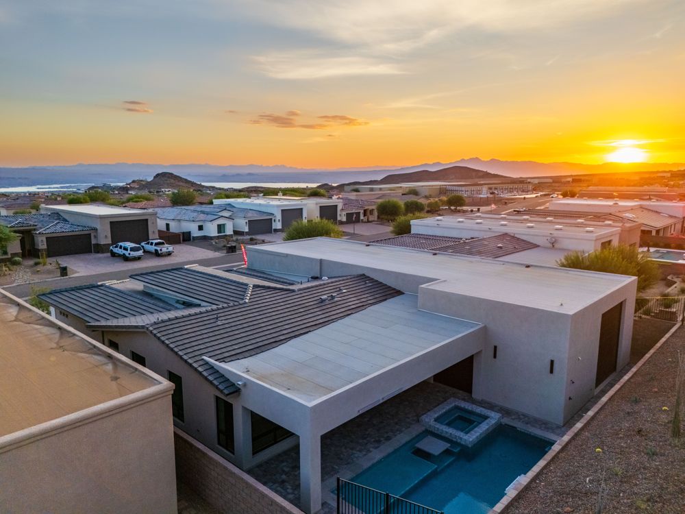 Sunset aerial of The Arroyos with Lake Havasu in the distance