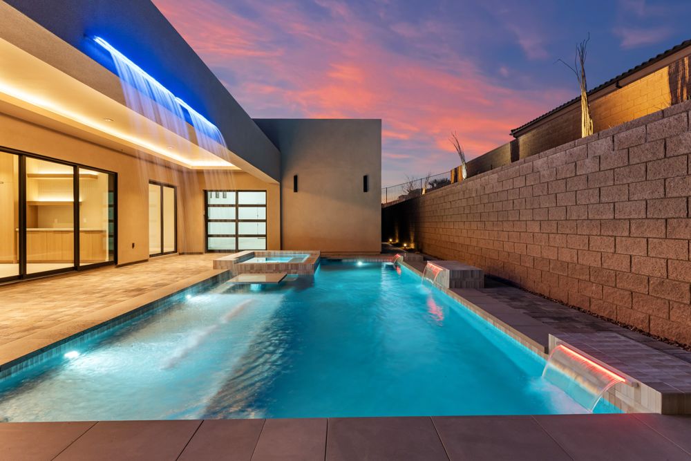 Pool at twilight with the sheer descent water feature