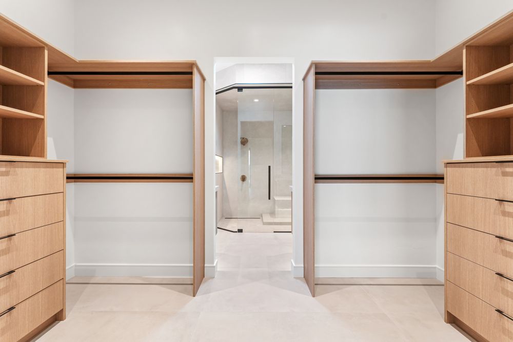 Primary walk-in closet with built-in drawers