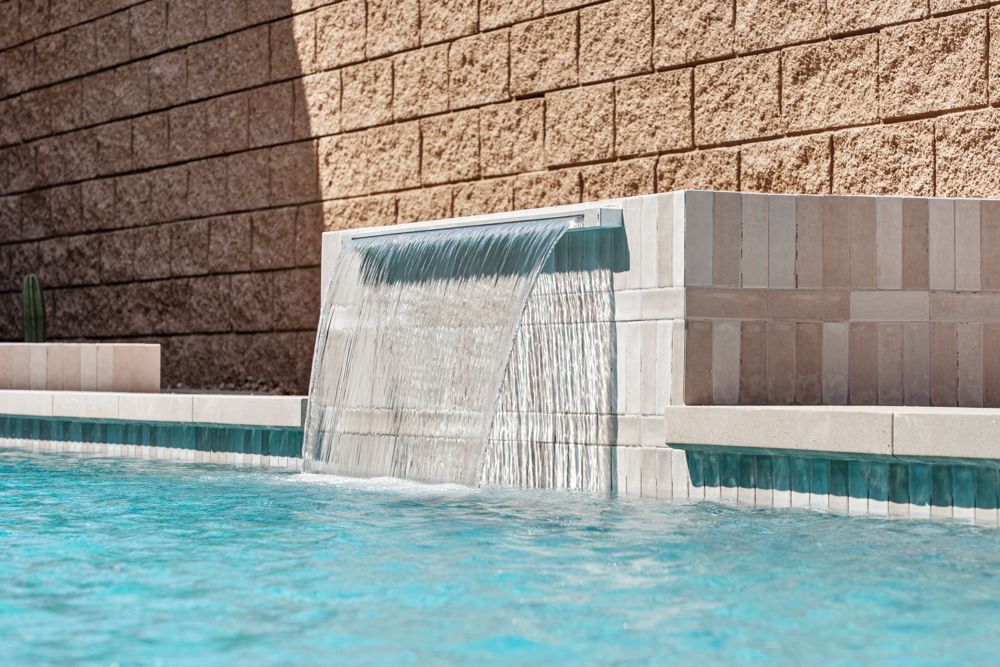 Water feature spilling into the pool