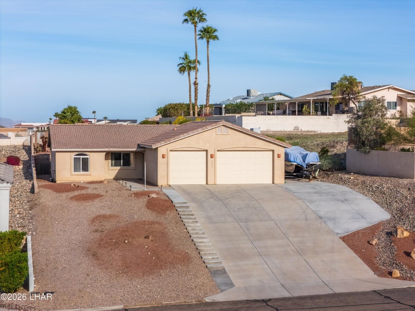 Front exterior of 2375 Beverly Glen Dr with two-car garage