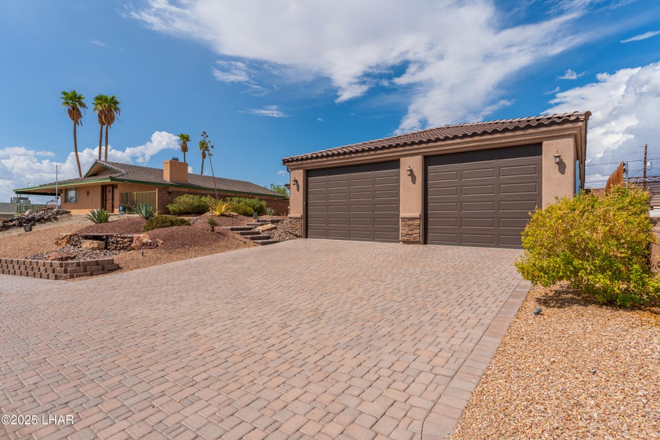 Front exterior of 2621 San Juan Dr with RV garage